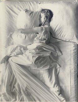 Irving Penn girl in bed with phone