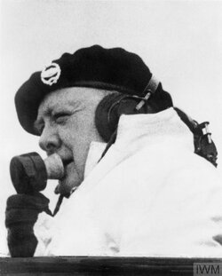 Churchill uses wireless phone from a tank turret