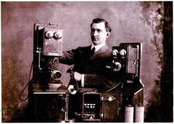 Henry Elston showing off his company's telephones